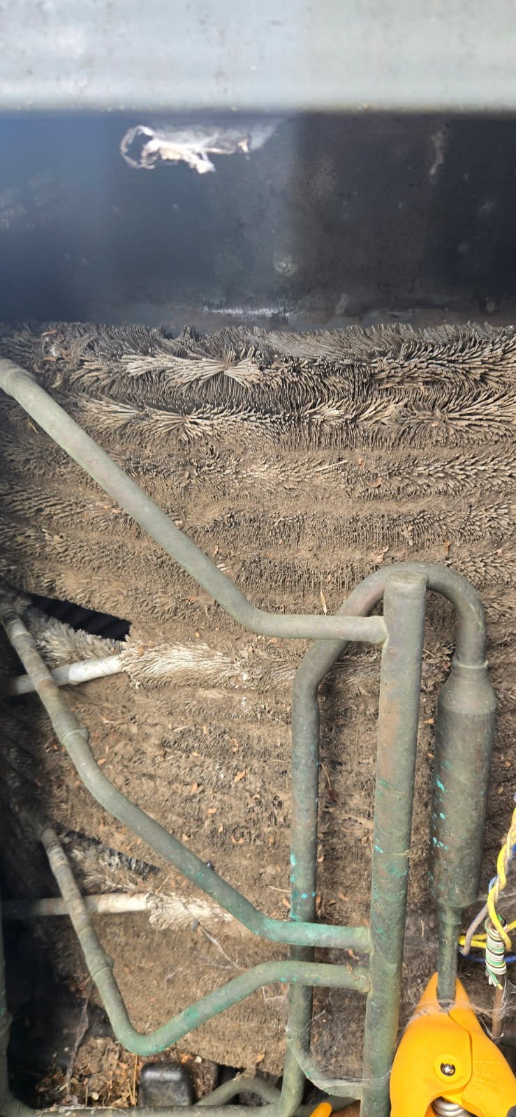 Dirty, debris-covered AC coil that can freeze and overflow, causing a water leak